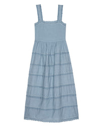 The Reverie Dress in Pale Blue by the Great is sleeveless with lace trim, a square neckline, and a gathered tiered skirt.