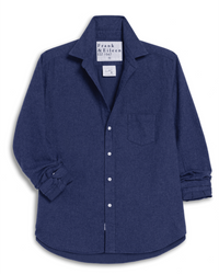 The Eileen Relaxed Button Up Shirt in Blue Melange by Frank & Eileen features long sleeves, a chest pocket, folded cuffs, and an EST 1947 collar label. Made from Italian cotton, the shirt is shown laid flat on a white background.