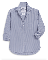 The Eileen Relaxed Button Up Shirt in White & Navy Stripe by Frank & Eileen is crafted from Italian cotton with long sleeves, a collar, one chest pocket, and partially rolled cuffs for effortless style.