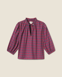 The Orly Blouse in Mulled Wine Plaid by Trovata Birds of Paradis features a ruffled collar, front slit with single button closure, and slightly puffed sleeves with elastic cuffs for a charming look.