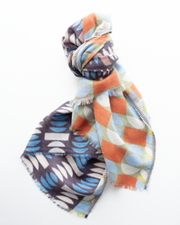 The Épice Pop Geo Wool Silk & Cashmere Scarf in Mauve, featuring geometric shapes, is displayed on a white background.