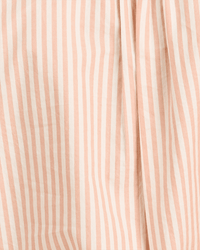 Close-up of the Emilia Oversized Shirt in Maple Stripe by Trovata Birds of Paradis, showing vertical pink and white stripes on slightly wrinkled, draped fabric that creates soft folds and gentle shadows.