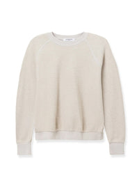 The perfectwhitetee Ziggy Inside Out Fleece L/S Shrunken Crew SS in Silver is a light beige, long-sleeve crewneck sweatshirt with ribbed details, made from soft inside out cotton fleece for comfort. Shown laid flat on a white background.