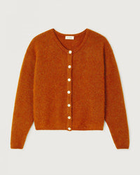 The American Vintage Vito Cardigan in Cuivre Chine, a burnt orange, long-sleeved wool alpaca style with white buttons, features a round neckline and soft textured fabric. Displayed flat on an off-white background with a vintage-inspired silhouette.