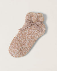 A single Barefoot Dreams CC Heathered Tennis Sock in Willow/White, folded and tied with a beige ribbon, sits on a plain light background—showcasing classic CozyChic comfort in every detail.