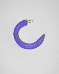 The C Hoop in Small in Blueberries for Sal by B&L, a single crescent-shaped earring with a pointed end and metal clasp from our handmade artisan collection, is displayed on a light textured background.
