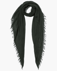 The Chan Luu Cashmere & Silk Scarf in Kombu Green is lightweight with frayed edges, draping softly in a loose loop. The fabric is soft and slightly sheer.