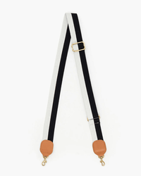 The Clare V. Adj Crossbody Strap in Black & Cream Stripe features a cotton leather strap with tan leather ends, gold-tone metal clasps and buckle, and is designed as an adjustable crossbody accessory for your Clare V. bag.