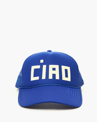 The Clare V. Block Ciao Trucker Hat in cobalt with a cream "CIAO" print features a blue mesh back, snapback closure, and is shown on a plain white background.