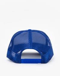 The Clare V. Block Ciao Trucker Hat in Cobalt with Cream is shown from the back, highlighting its adjustable snapback closure and flat bill against a white background.