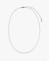 The Clare V. Fine Box Chain Necklace 16in in Sterling Silver features a simple clasp and adjustable extension, displayed in an oval shape on a plain white background.