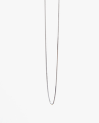 The Clare V. Fine Box Chain Necklace 16in in Sterling Silver is shown against a plain white background, its delicate sterling silver chain catching the light with subtle elegance.