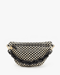 The Clare V. Grande Fanny in Black & Cream Woven Checker features a black and cream checkerboard pattern, gold-tone zipper, and chunky black chain strap, shown on a plain white background.