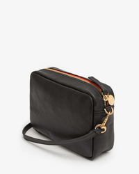 The Clare V. Midi Sac in Black Napetto is a mid-size crossbody bag crafted from Italian leather, featuring a gold zipper, elegant gold hardware, a rectangular shape, and a matching black strap.