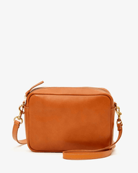 The Clare V. Midi Sac in Tan Napetto is a rectangular Italian leather bag with a zip closure, adjustable strap, and gold hardware, shown against a plain white background.