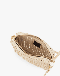 A top view of the Clare V. Midi Sac - Rattan in Cream crossbody bag shows a zippered opening, light fabric lining, and a small interior pocket.