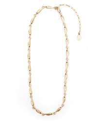 The Clare V. Sardine Chain in Vintage Gold is a gold-plated necklace with small fish-shaped links, an adjustable extension, and a signature oval tag at the clasp.