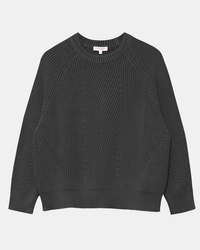 The Chelsea Washed Cotton Sweater in Black by Demylee features a dark gray rib knit, long sleeves, a crew neckline, ribbed cuffs and hem, and a geometric texture on the front. Made from soft organic cotton for comfort and style.