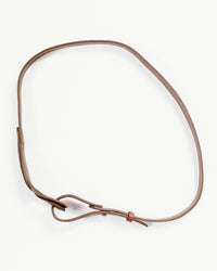 The Depalma Handsewn Nuova 3/4 inch Single Wrap in Bark/Brass is displayed in a loose oval on a white background, showcasing its simple metal buckle, loop, and a stylish brass button fastener.