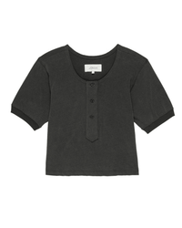 The Great’s Scoop Henley in Washed Black is a short-sleeve, boxy 100% cotton tee with three front buttons and a round neckline, offering a vintage-inspired look.