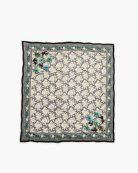 Floral patterned scarf with black border on a white background