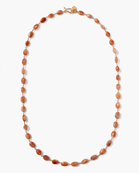 The Chan Luu Santa Fe Necklace in Sunstone features a simple single strand of oval-shaped, reddish-brown beads and is finished with a small gold clasp at the top.