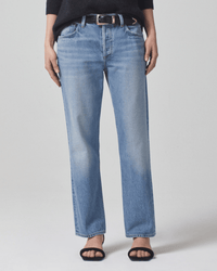 Person wearing Misty Neve Low Slung Relaxed pants by Citizens of Humanity, with a black belt, black top, and black open-toe sandals. The photo shows only their torso and legs against a plain light background.