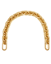 The Clare V. Shortie Strap in Vintage Gold features a curved, chunky gold chain with large interlocking links and clasp hooks on both ends, styled as a removable bag strap and shown arching on a white background.