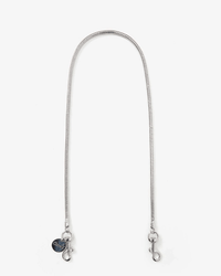 The Clare V. Snake Chain Shoulder Strap in Silver features lobster claw clasps and a small round charm near one end, perfect for elevating any bag. It is displayed on a white background.