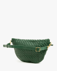 The Clare V. Woven Zig-Zag Grande Fanny in Evergreen features green woven leather, a gold buckle, and an adjustable strap, shown against a plain white background.