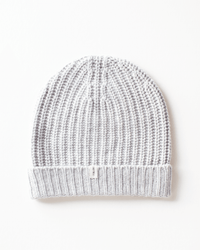 The COLORI Ribbed Beanie in Shark features a light gray ribbed knit and a folded brim with a small white tag, combining style and comfort. Displayed on a white background, it’s the perfect cozy winter hat.