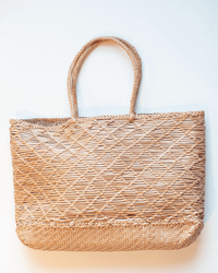 The Dragon Diffusion EW Corso Bag in Natural is a rectangular, spacious tote with two handles and a woven crosshatch design, shown on a white background.