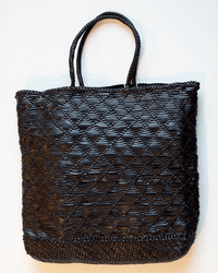 The Dragon Diffusion NS Corso Bag in Black is a two-handle tote with a diamond-patterned woven leather texture, shown against a plain white background.
