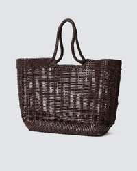 The Dragon Diffusion Window Basket in Dark Brown is a hand-woven, rectangular basket bag with two handles and an open, airy design, shown on a light grey background.