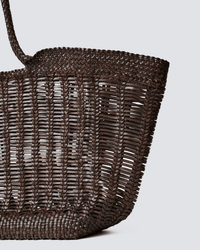 A close-up of the Dragon Diffusion Window Shopper tote in dark brown, featuring an open airy pattern and braided handle, set against a plain light gray background.