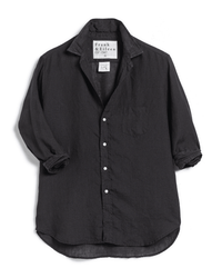 The Frank & Eileen Eileen Relaxed Button Up in Black Performance Linen is a women's long-sleeve shirt with a front pocket, collar, and rolled-up sleeves, shown on a white background.