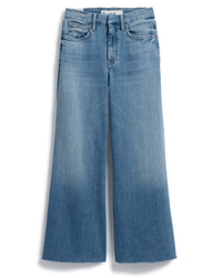 The Frank & Eileen Galway Gaucho in 1972 Light Wash Indigo features a wide leg, high waist, classic five-pocket design, front and back pockets, raw hems, and a slightly faded light blue wash.