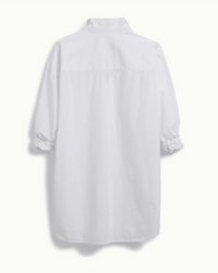 The Frank & Eileen Shirley Oversized Button Up in White Everyday Poplin is shown from the back, featuring loose sleeves gathered at the cuffs and a relaxed fit in crisp, lightweight fabric for effortless style.