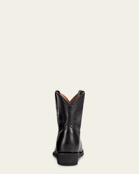 The FRYE Billy Short in Black is shown from the back, highlighting its low stacked heel and gently curved top edge against a plain light background.