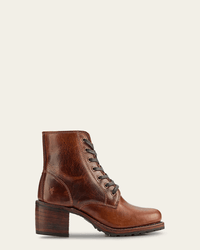 The FRYE Sabrina 6G Lace Up in Cognac is a brown, oil-tanned leather boot with a stacked wooden heel and textured finish, shown in side profile on a plain light background.