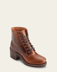 The FRYE Sabrina 6G Lace Up in Cognac is a brown oil-tanned leather boot with visible stitching, a stacked heel, and rugged sole, featuring a vintage finish reminiscent of classic Frye boots, shown against a plain light background.