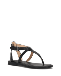 The FRYE Taylor Sandal in Black features full grain leather, a thong toe strap, crisscross straps, and an adjustable buckle ankle strap on a flat sole.