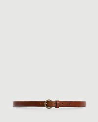 Hartford Amour Belt in Brown: A slim, genuine leather belt with a round brass buckle, laid flat on a light grey background. Crafted in Italy for classic style.