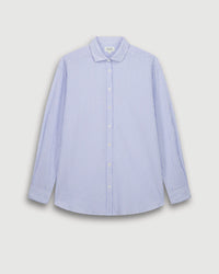 The Charlot Shirt in White & Blue by Hartford showcases light blue and white vertical stripes, long sleeves, a classic collar, and button-up front, set against a plain light gray background.