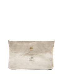 The Classic Case in Platino by IL BISONTE is an Italian-made metallic gold leather clutch with brass hardware and a flap closure, featuring a small embossed logo at the bottom center. Its simple, elegant design showcases superb craftsmanship.