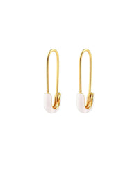 The Kris Nations Safety Pin Enamel Hoop Earrings in White & 18K Gold Vermeil feature elongated safety pin shapes with white enamel accents, shown on a plain white background.