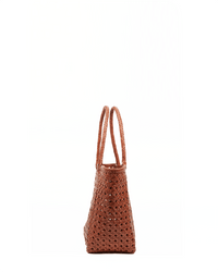 The Annette Petit Cuir Bag in Picante by Maison N.H Paris is shown from the side on a white background, highlighting its textured woven material and double handles.