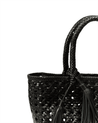 Close-up of the Maison N.H Paris Malibu Cuir Bag in Black, featuring two braided handles and decorative tassels—a chic handmade woven tote perfect for any occasion, photographed against a white background.