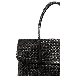 Close-up of the Maison N.H Paris Violette Petit Cuir Flap Bag in black, featuring a structured flap and single curved handle, set against a white background.