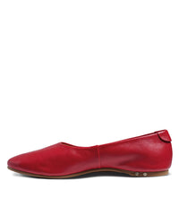 The beek. Swiftlet in Lipstick is a red leather ballet flat with a slightly pointed toe, low heel, memory foam footbed, and metallic accents near the sole, shown on a white background.
